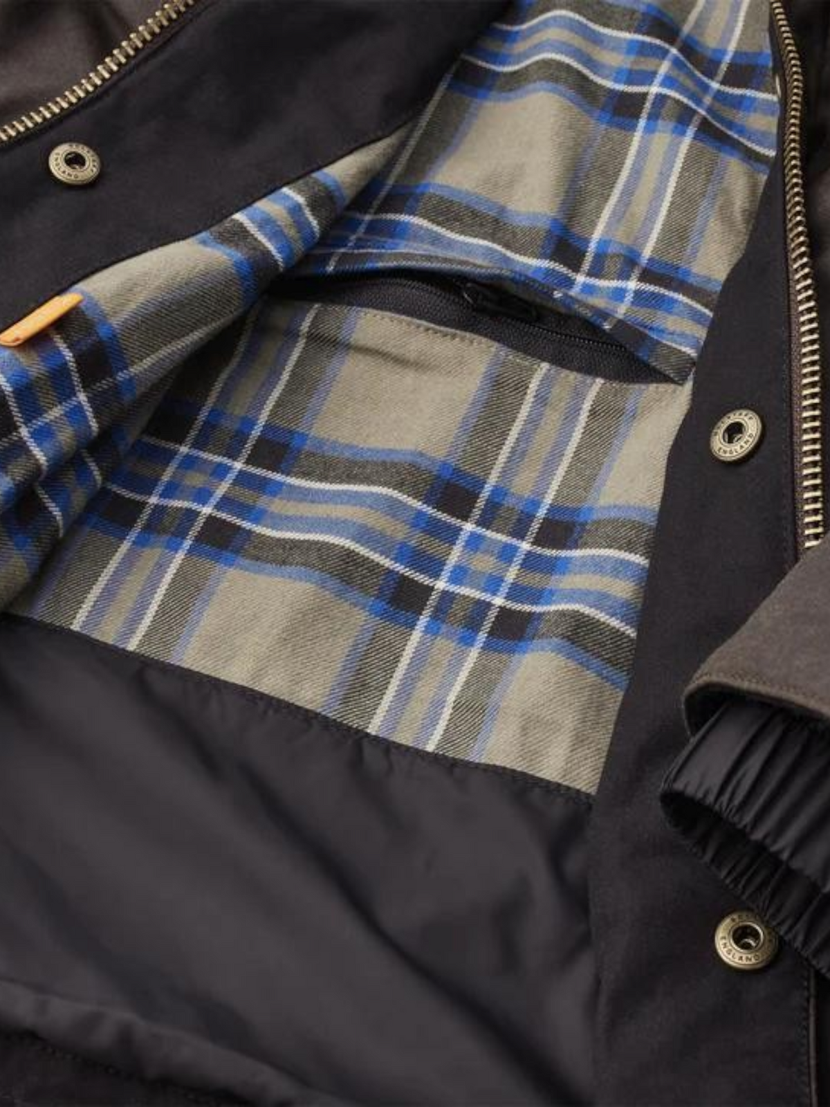 Baffle Haus Crosby motorcycle jacket in mahogany waxed cotton with archival check lining and antique brass hardware