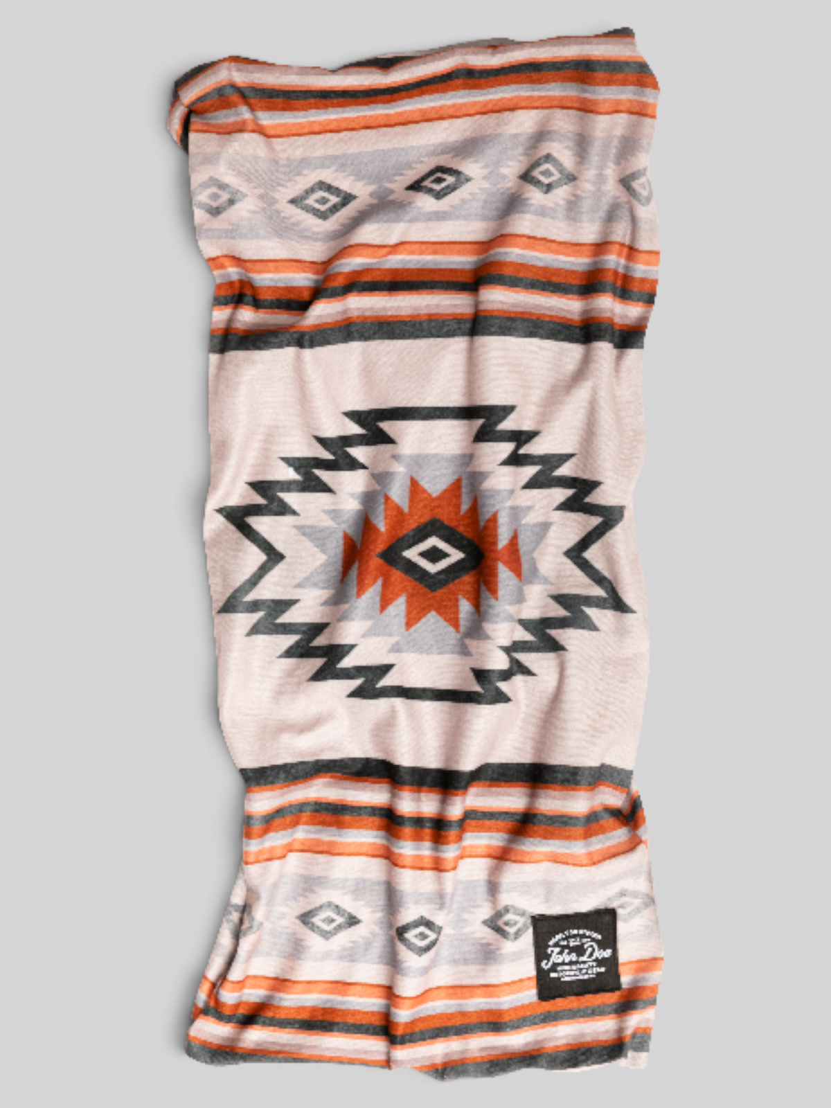 Baffle Haus John Doe Chicano neck tube in breathable Coolmax microfiber with a geometric orange and grey pattern