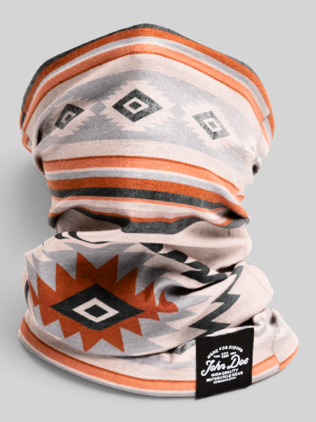 Baffle Haus John Doe Chicano neck tube in breathable Coolmax microfiber with a geometric orange and grey pattern.