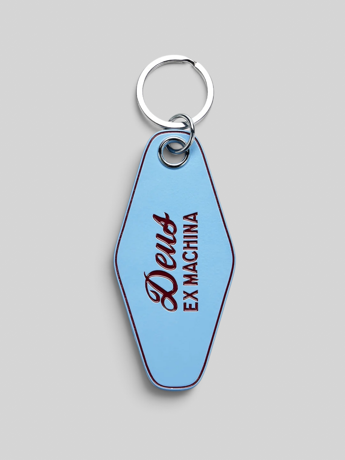 Baffle Haus Venice Key Tag in glacier blue enamel with Deus Ex Machina branding and a metal keyring attachment.