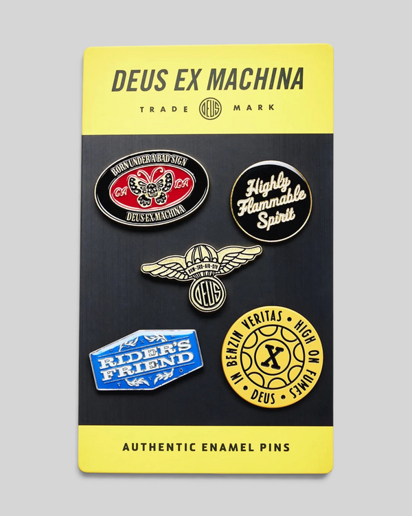 Baffle Haus Machina enamel pin set featuring five unique graphic designs on a yellow and black display card