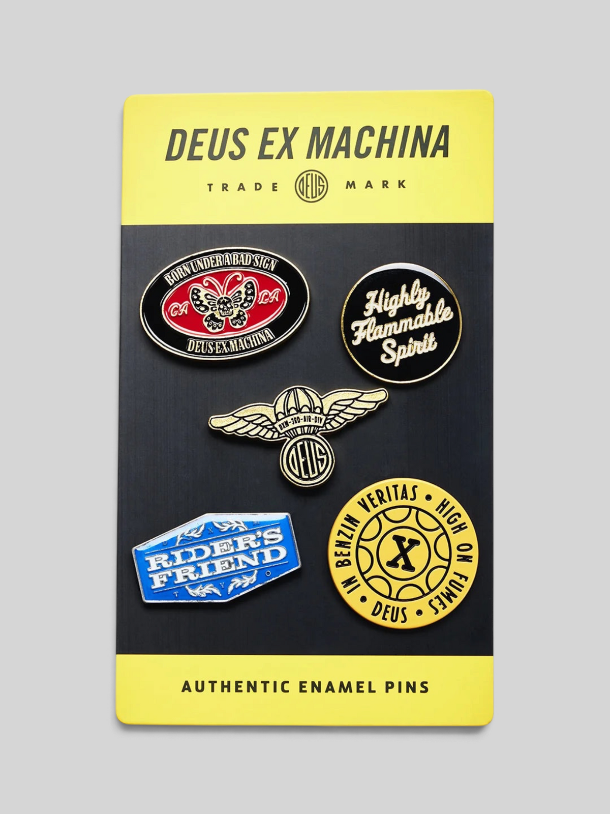 Baffle Haus Machina enamel pin set featuring five unique graphic designs on a yellow and black display card