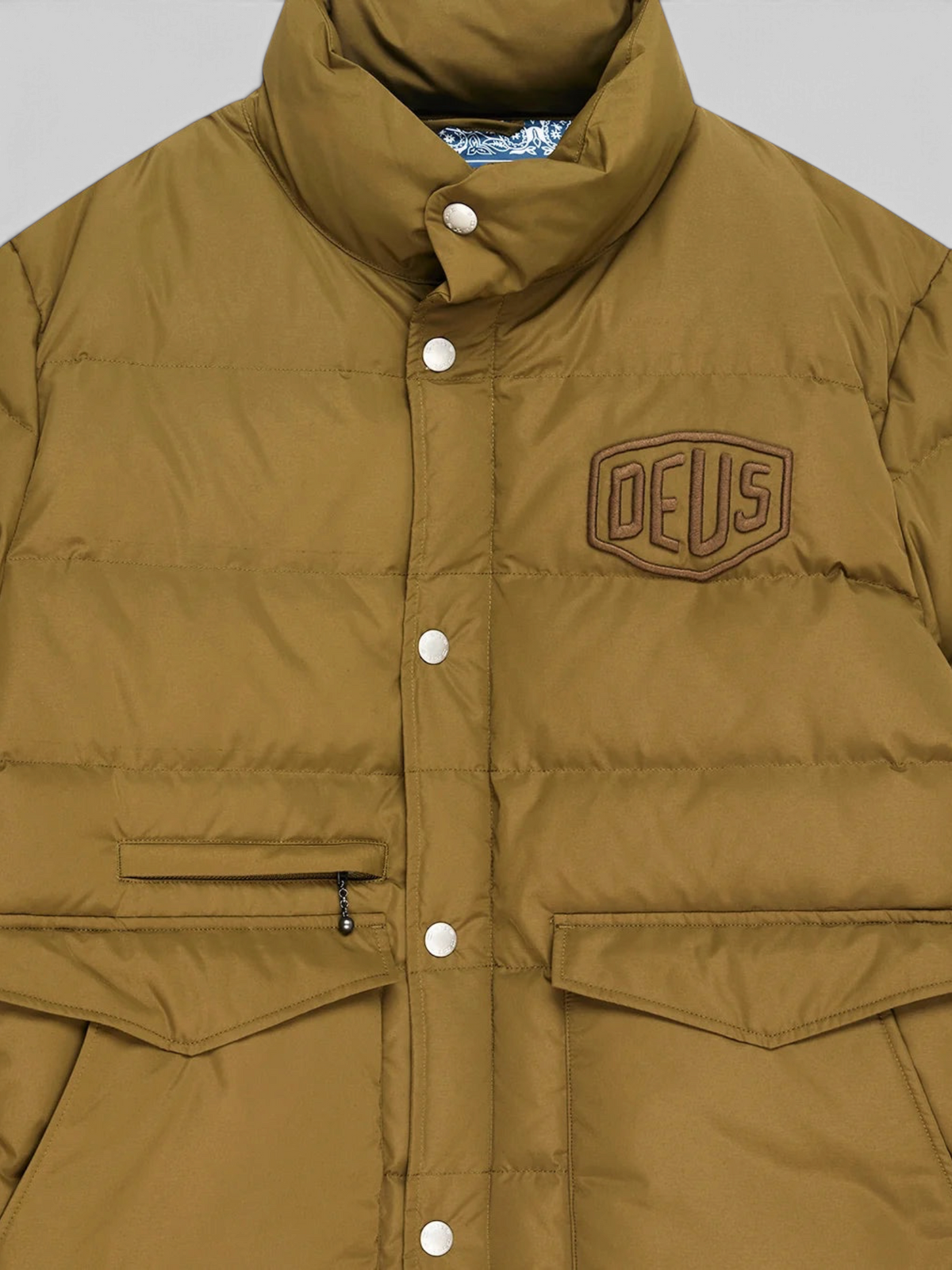 Baffle Haus Carson olive down jacket with chest branding, flap pockets, and snap button front closure.