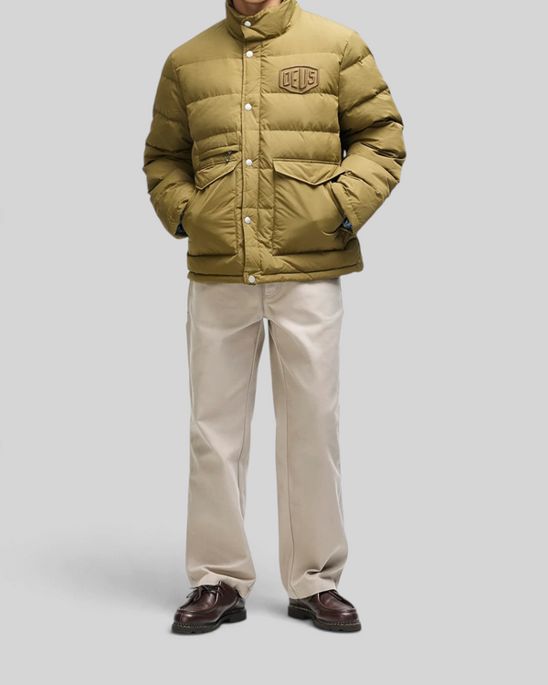 Baffle Haus Carson olive down jacket with high density chest branding, patch pockets, and snap placket closure.
