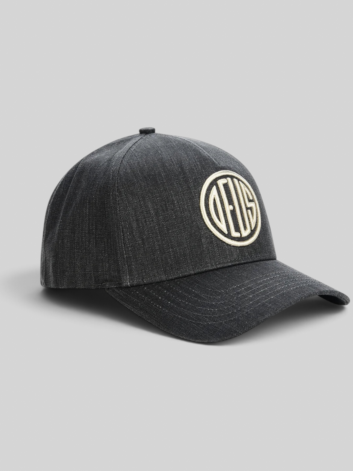 Baffle Haus black 5-panel cap in textured cotton twill with high-density embroidered circular logo on the front