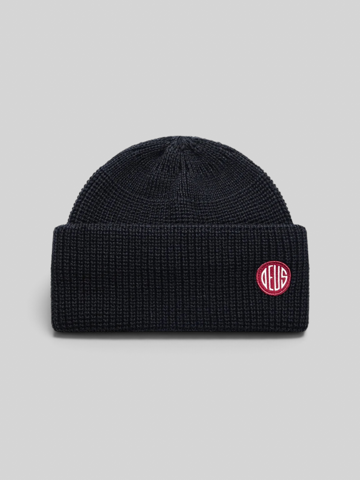 Baffle Haus Crosland black wool watch cap beanie with a double fold turnover and a circular knit crown construction.