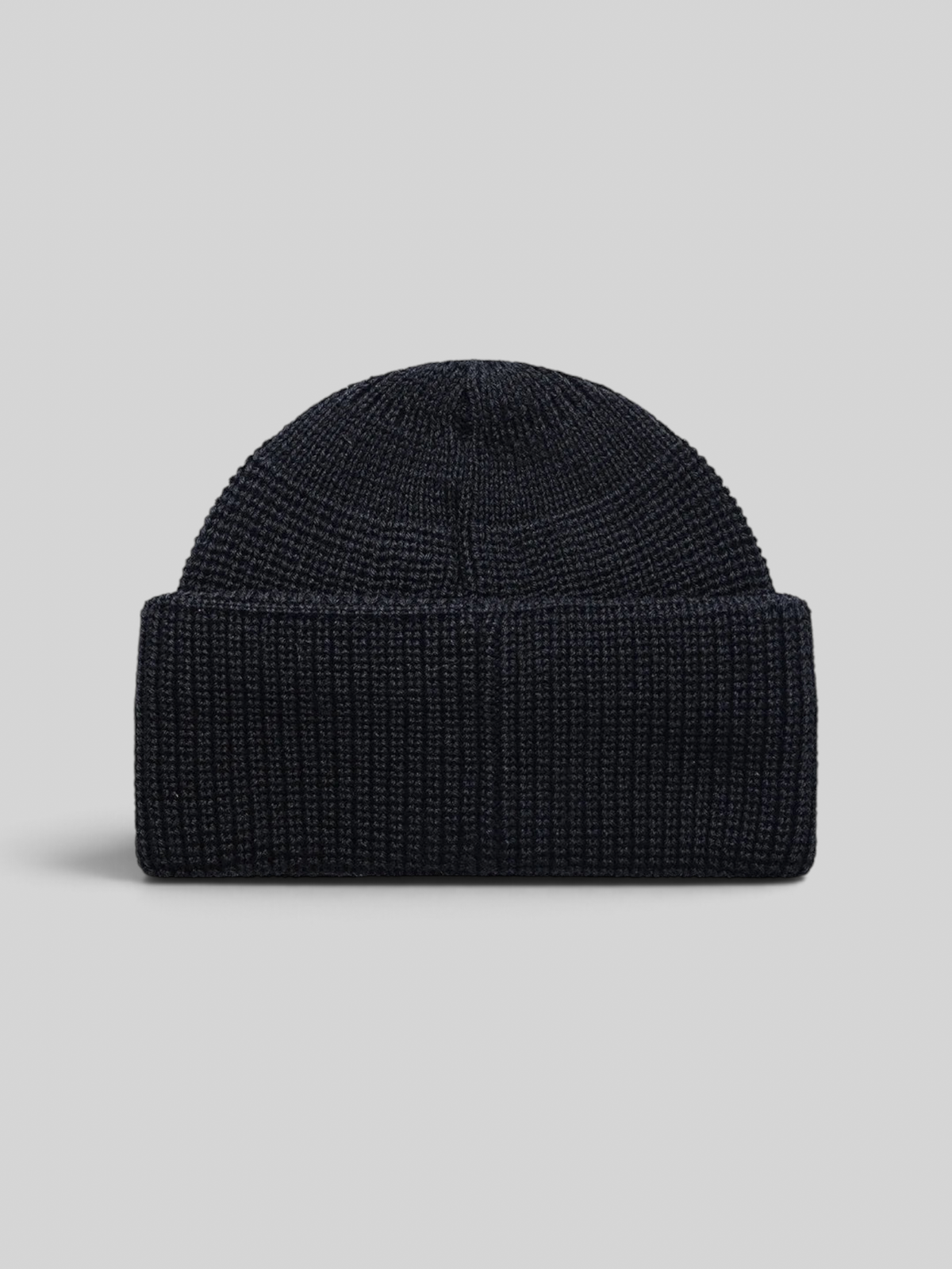 Baffle Haus Crosland black wool watch cap beanie with a double fold turnover and circular knit crown construction.