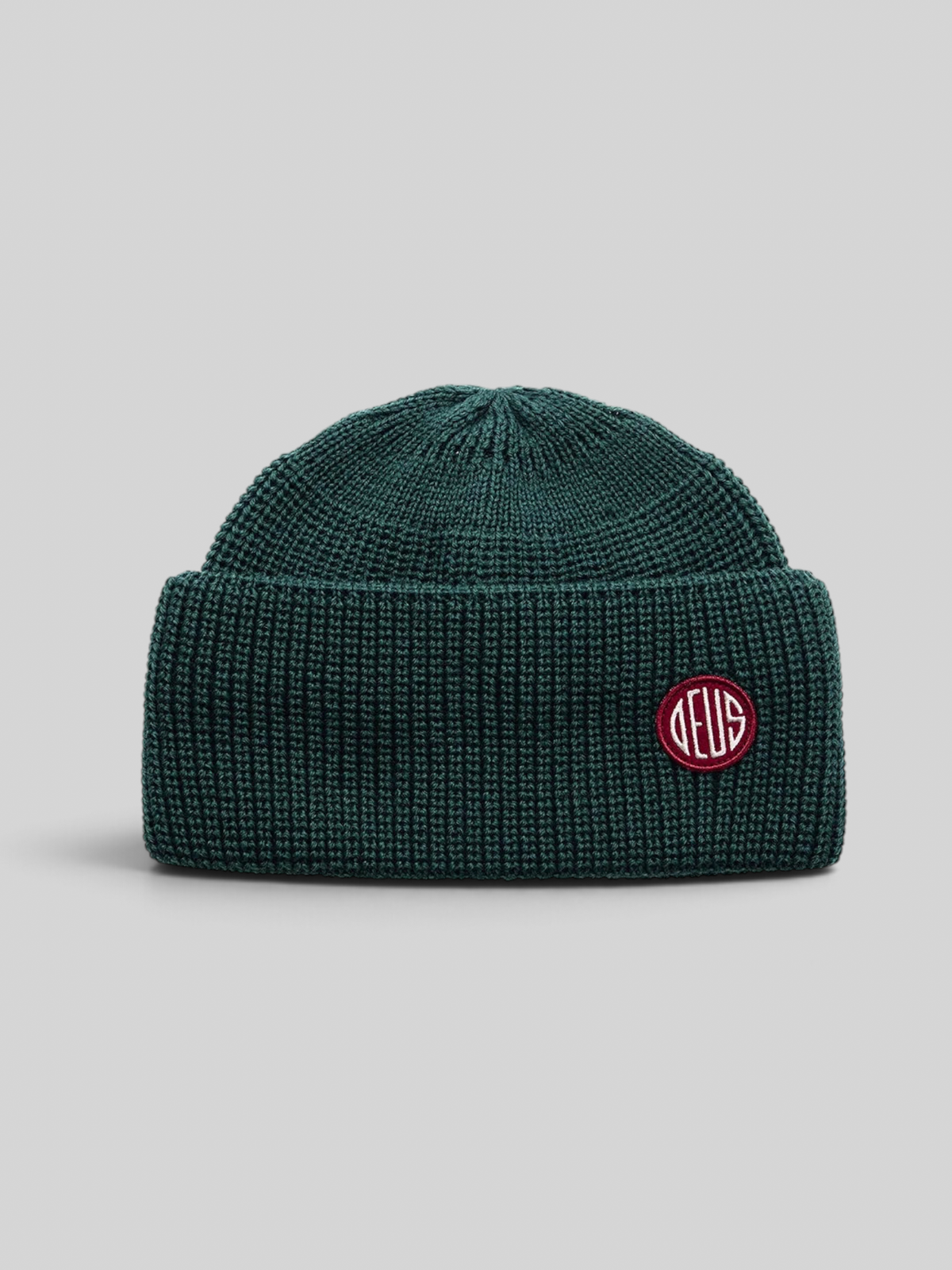 Baffle Haus Crosland beanie in racing green wool with a double fold turnover and circular knit crown construction.