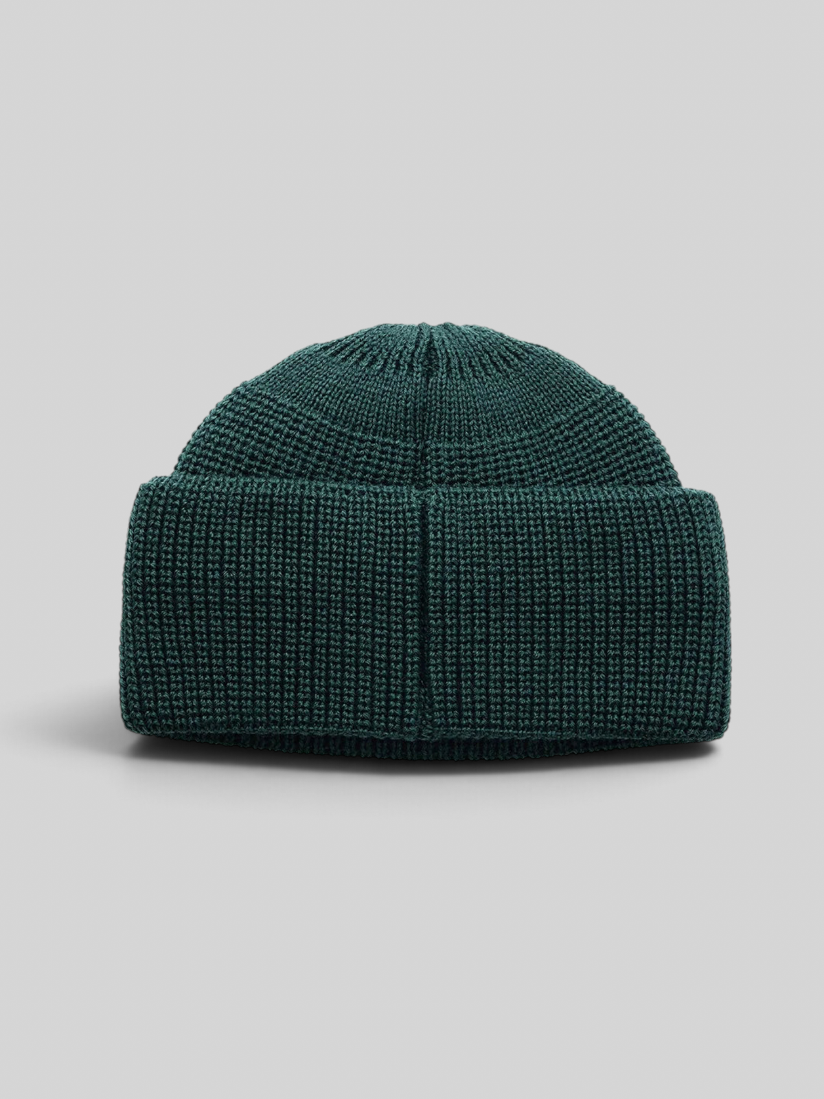 Baffle Haus Crosland wool watch cap beanie in racing green with a double fold turnover and circular knit crown.