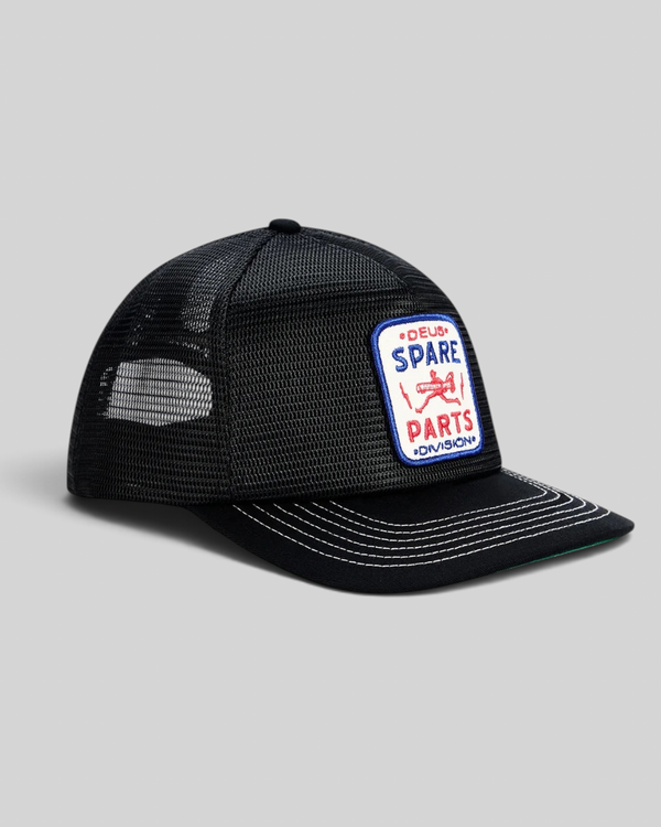 Baffle Haus black 5-panel trucker cap with mesh back and embroidered Spare Parts Division badge on the front