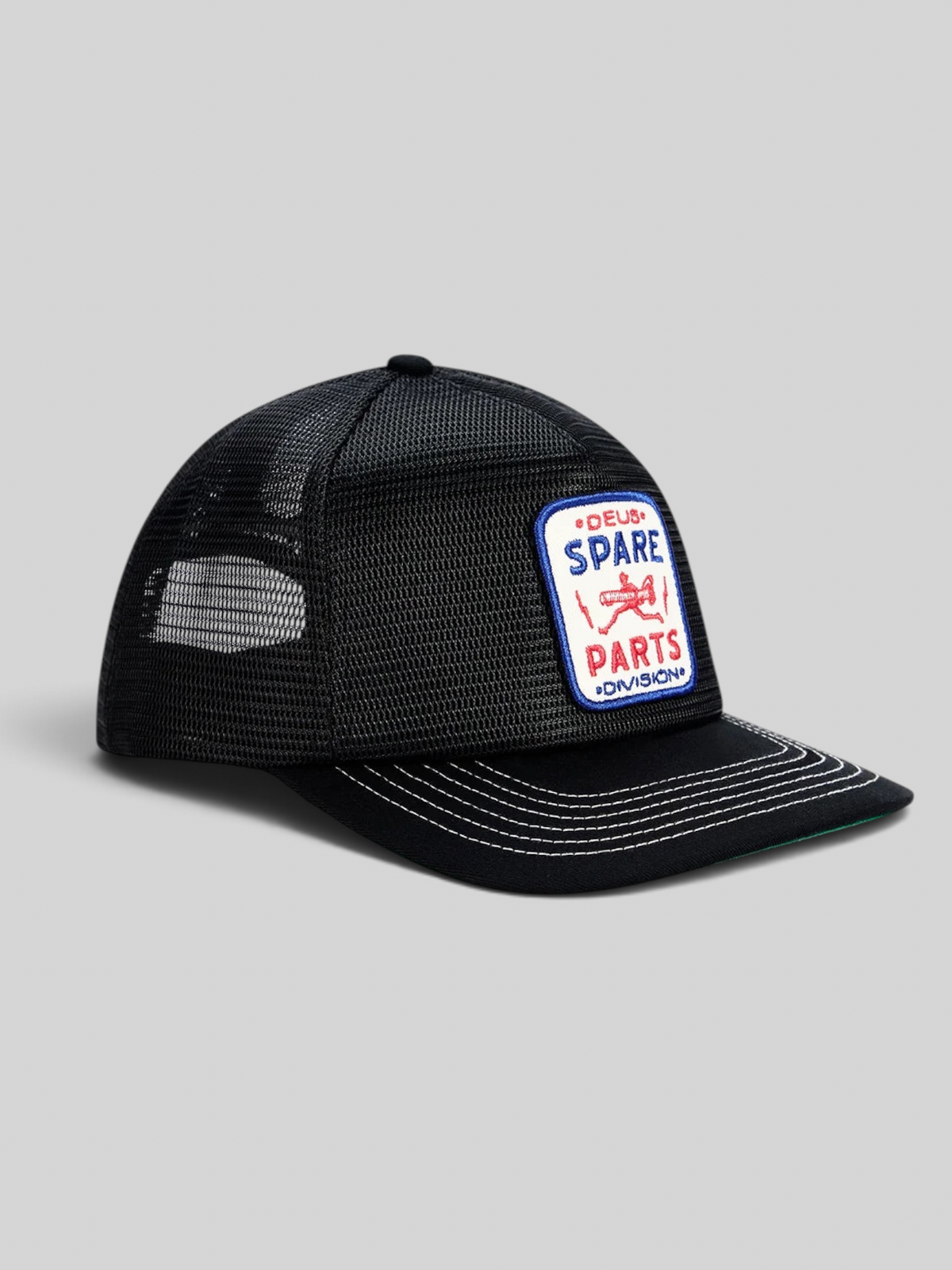 Baffle Haus black 5-panel trucker cap with mesh back and embroidered Spare Parts Division badge on the front