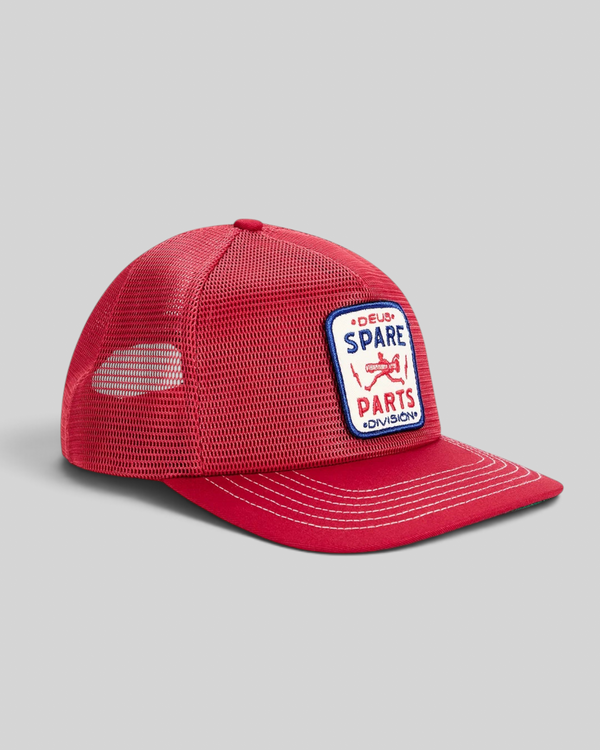 Baffle Haus cherry red 5-panel trucker cap with polyester mesh back and embroidered Spare Parts badge on the front
