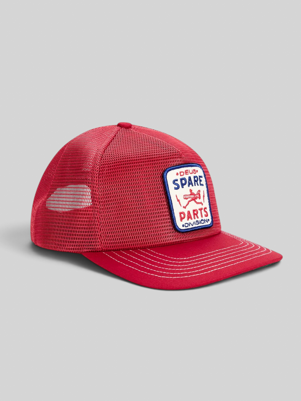 Baffle Haus cherry red 5-panel trucker cap with polyester mesh back and embroidered Spare Parts badge on the front