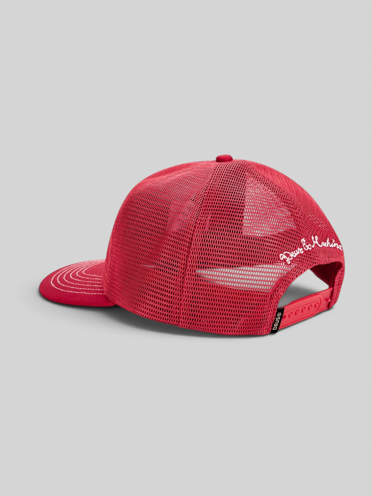 Baffle Haus Mudflap trucker cap in cherry red with polyester mesh back, snap adjuster, and embroidered side detail.