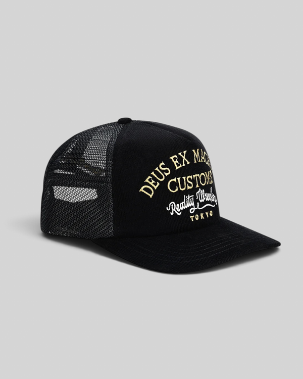 Baffle Haus Marsden Trucker cap in black corduroy with mesh back and gold embroidered front graphic
