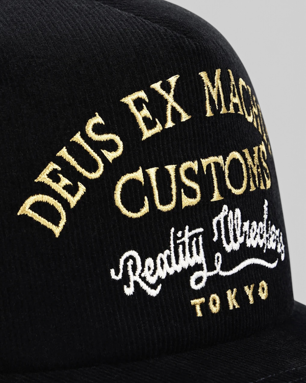 Baffle Haus Marsden black corduroy trucker cap with gold and white embroidered graphic detail on the front panel
