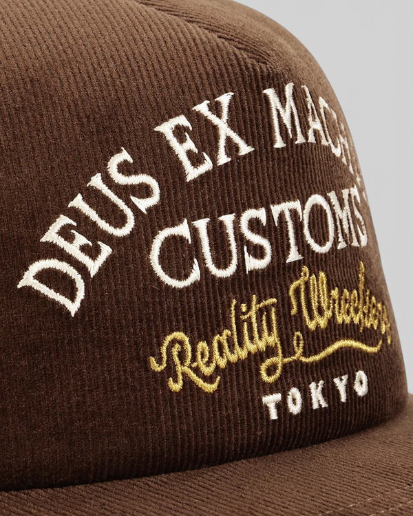 Baffle Haus Marsden brown corduroy trucker cap with white and gold embroidered front graphic detail