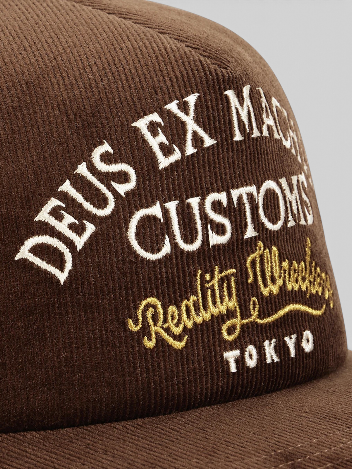 Baffle Haus Marsden brown corduroy trucker cap with white and gold embroidered front graphic detail