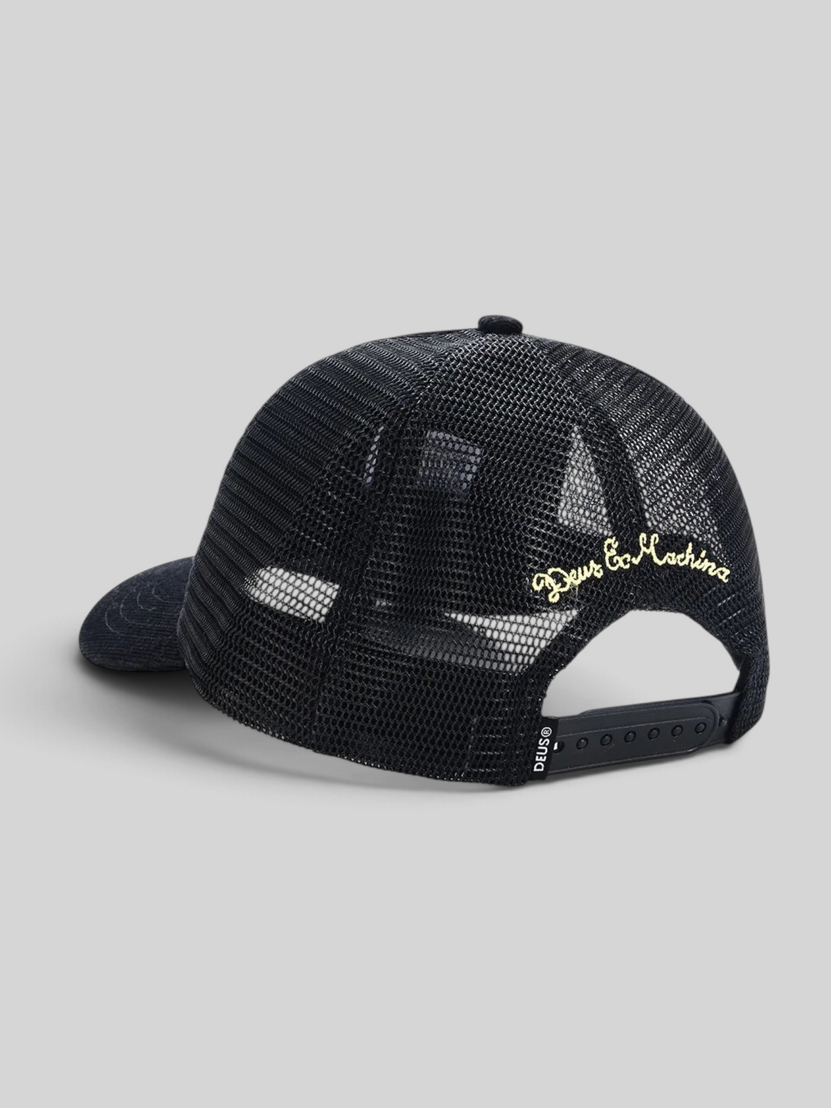 Baffle Haus black trucker hat with mesh back, gold embroidery, and adjustable plastic snap closure
