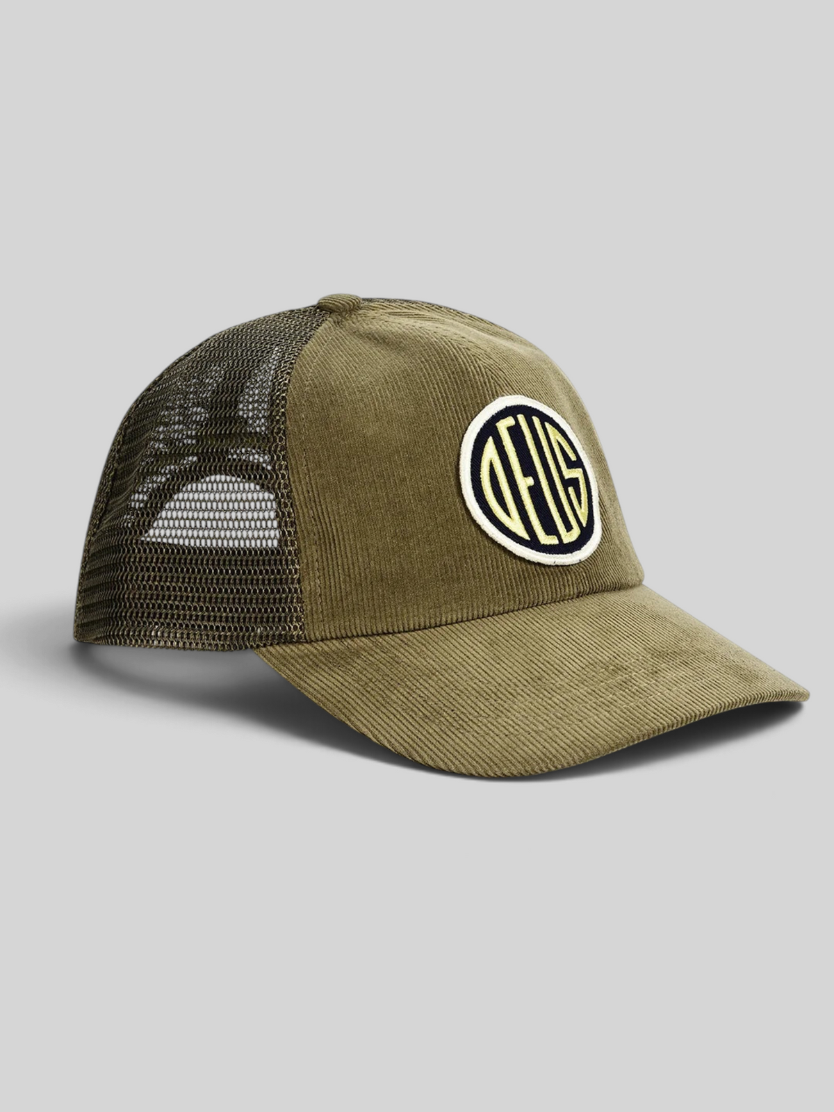 Baffle Haus olive green cotton corduroy trucker hat with a circular embroidered logo patch and mesh back panel