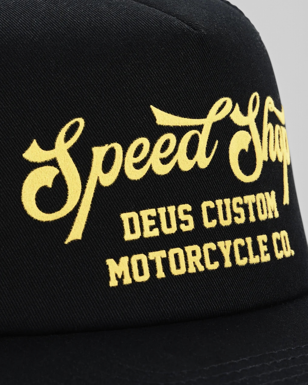Baffle Haus Welcome Trucker cap in black with yellow flocked Speed Shop graphic on the front panel