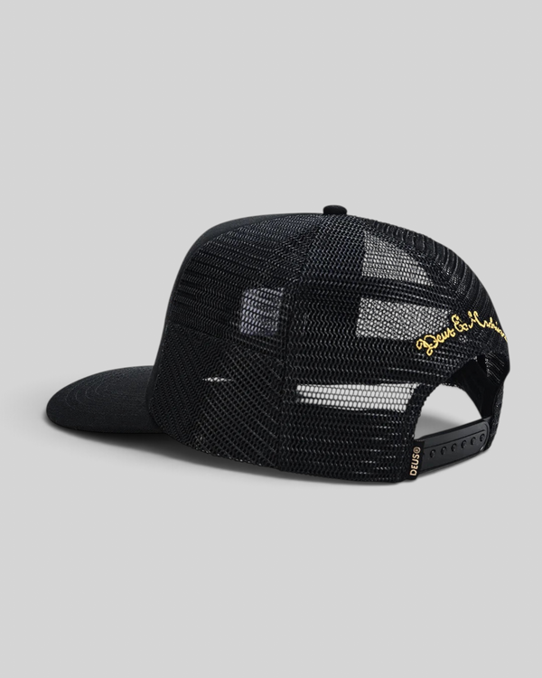 Baffle Haus Welcome Trucker cap in black with mesh back, snapback closure, and gold embroidered detail