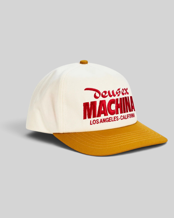Baffle Haus Primo Cap in cream cotton twill with a radiant yellow brim and red embroidered Deus Ex Machina logo.
