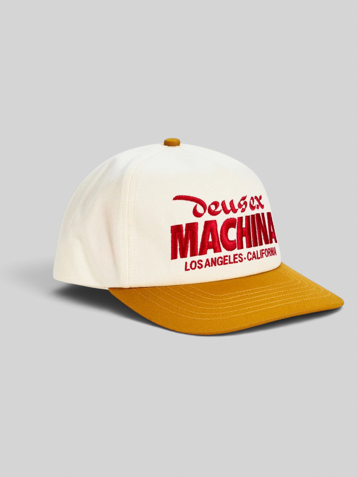 Baffle Haus Primo Cap in cream cotton twill with a radiant yellow brim and red embroidered Deus Ex Machina logo.