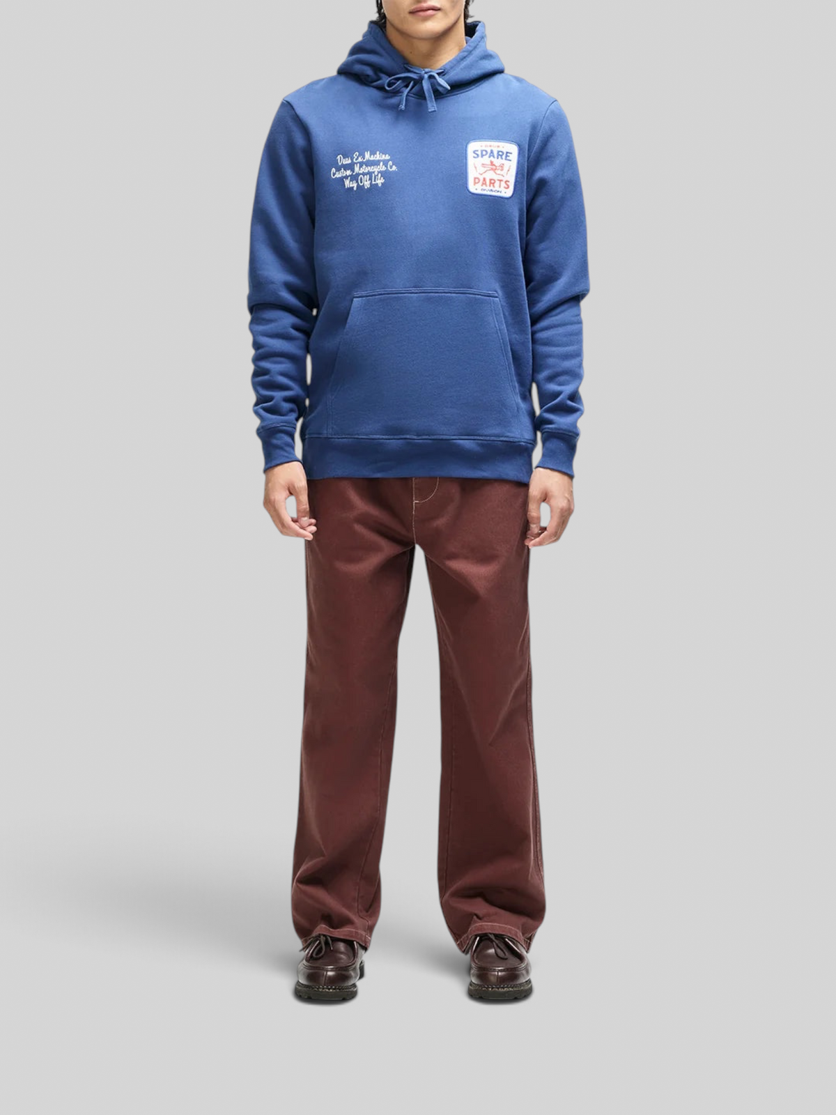 Baffle Haus Mudflap Hoodie in mechanic blue organic cotton fleece with embroidered chest art and kangaroo pocket.