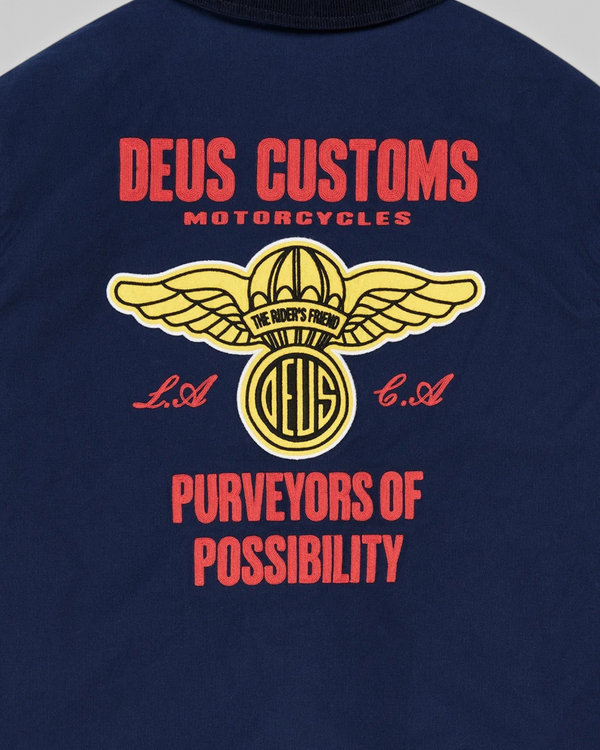 Baffle Haus navy cotton whipcord jacket featuring detailed red and yellow embroidered motorcycle graphic on the back