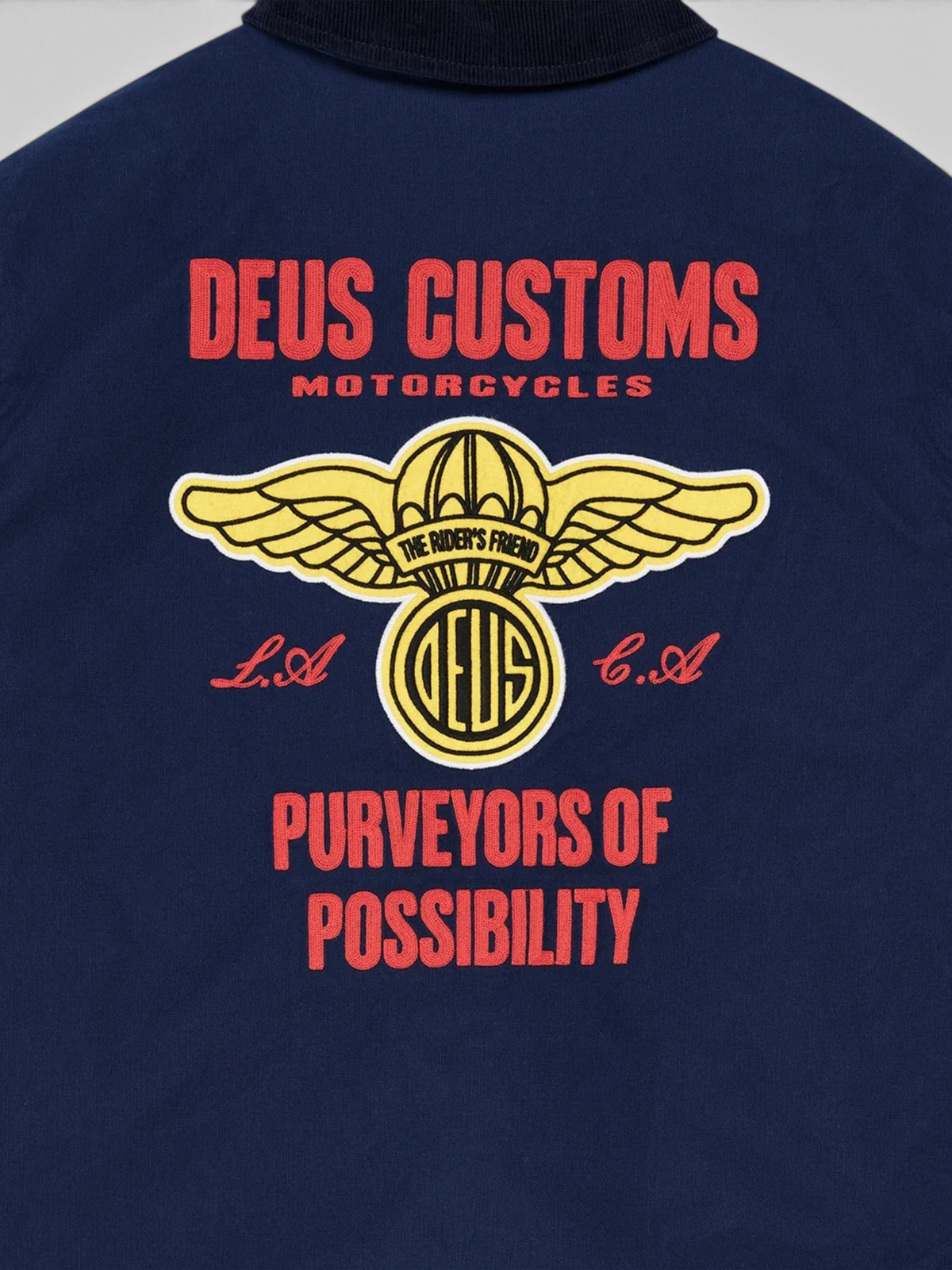 Baffle Haus navy cotton whipcord jacket featuring detailed red and yellow embroidered motorcycle graphic on the back