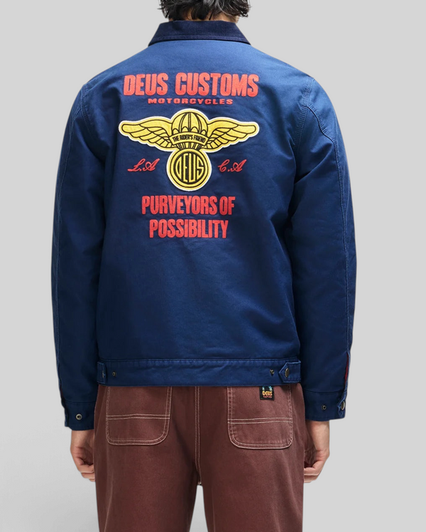 Baffle Haus navy cotton whipcord jacket with large yellow and red embroidered graphic on the back