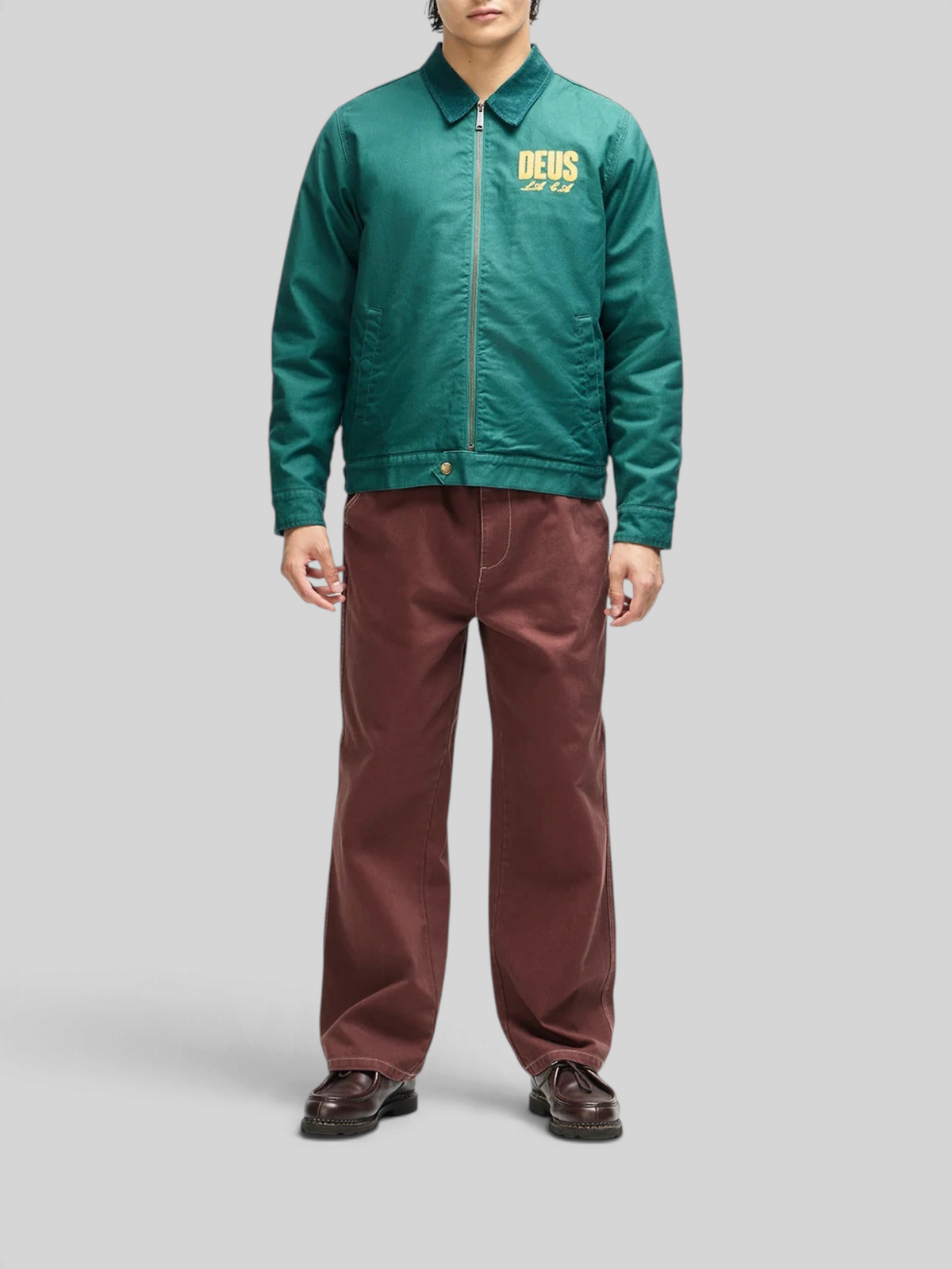 Baffle Haus racing green cotton whipcord cutaway jacket with yellow chest embroidery and zip front closure