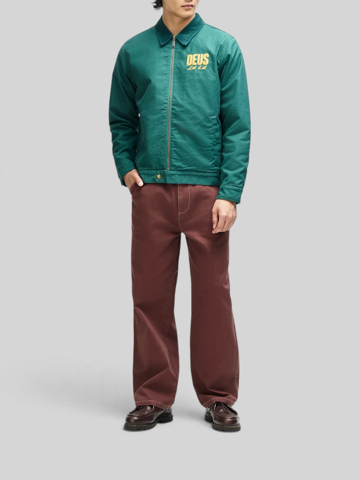 Baffle Haus racing green cotton whipcord cutaway jacket with yellow chest embroidery and zip front closure
