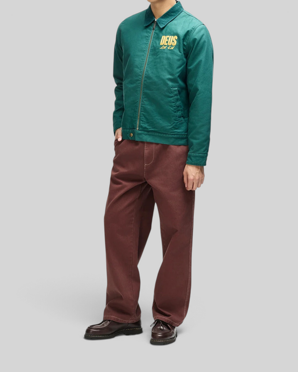 Baffle Haus racing green cotton whipcord jacket with zip front, embroidered chest logo, and adjustable hem snaps.