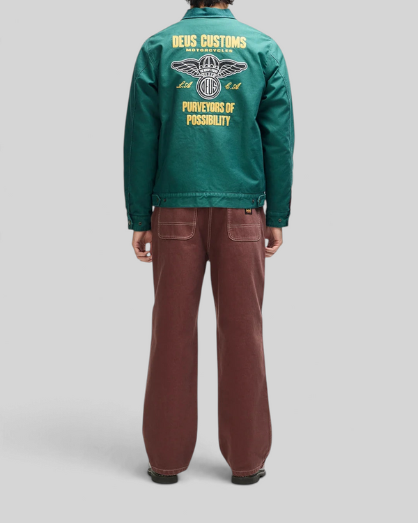 Baffle Haus racing green cotton whipcord cutaway jacket with yellow embroidered back graphic and zip front closure.