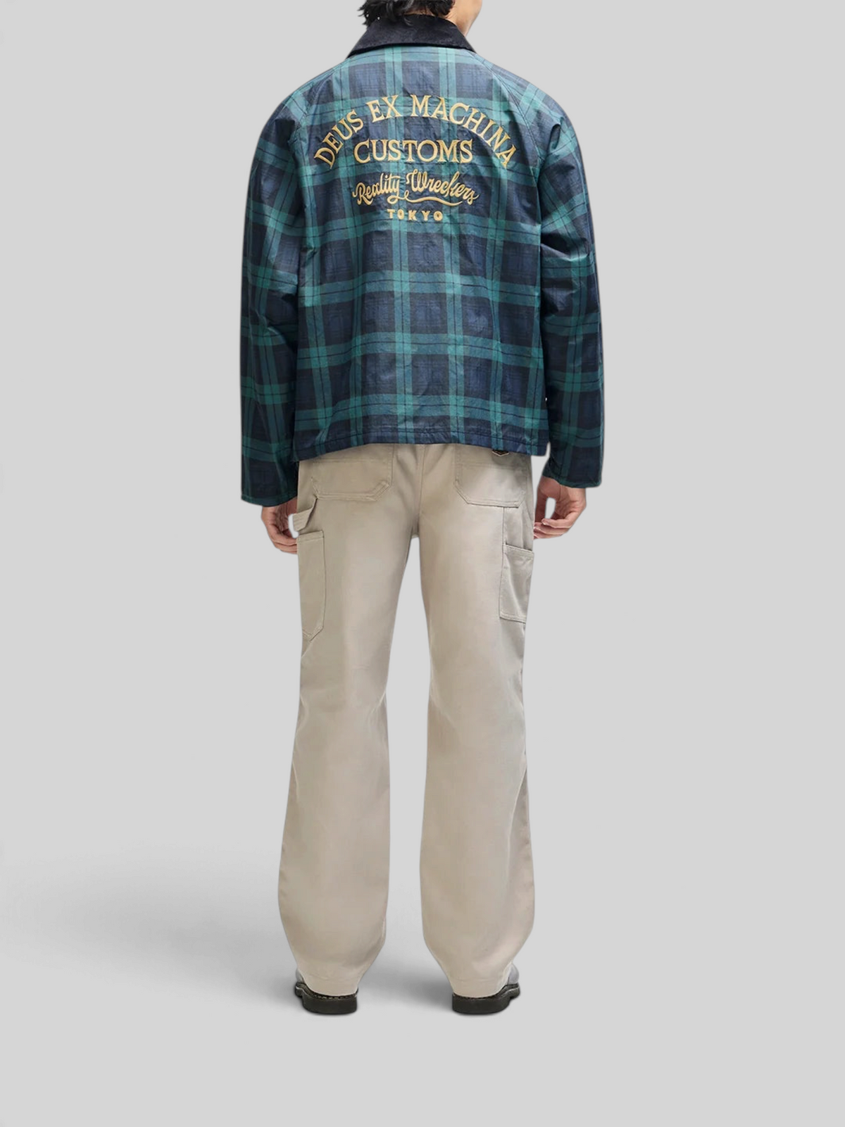Baffle Haus Marsden hunting jacket in green check with embroidered back detail worn by a model from behind