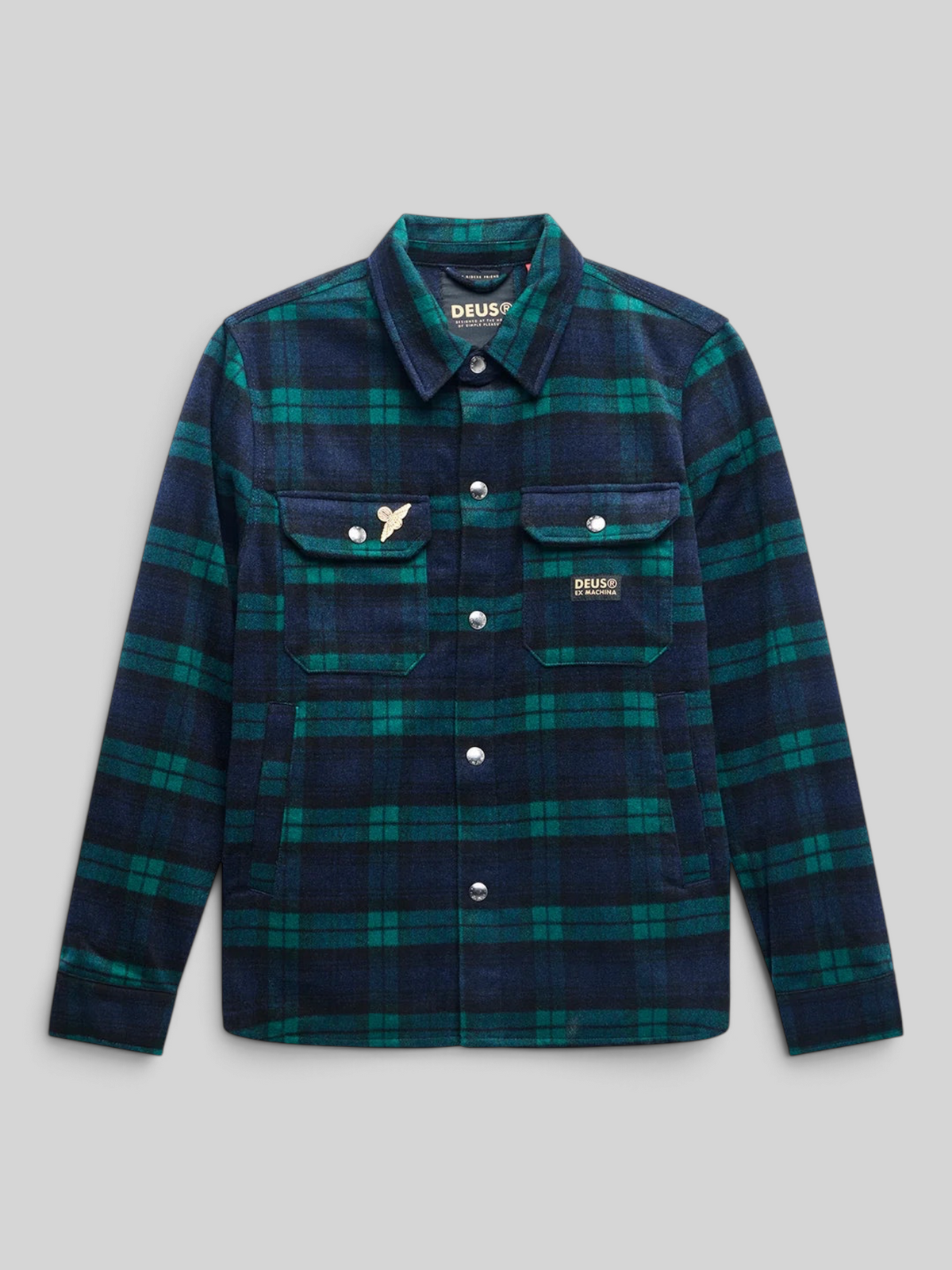 Baffle Haus Maxwell green and navy check wool-blend shirt with snap buttons, chest pockets, and metal pin detail.