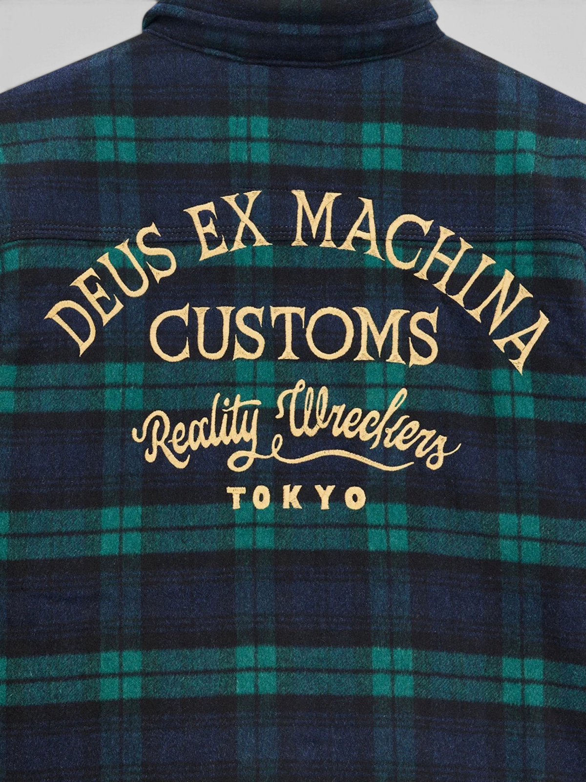 Baffle Haus Maxwell green check wool blend shirt featuring embroidered Deus Ex Machina back graphic detail