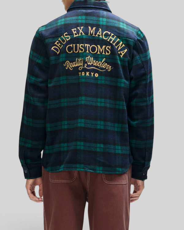 Baffle Haus Maxwell green check wool-blend shirt with gold embroidered back art, worn by a model from behind.