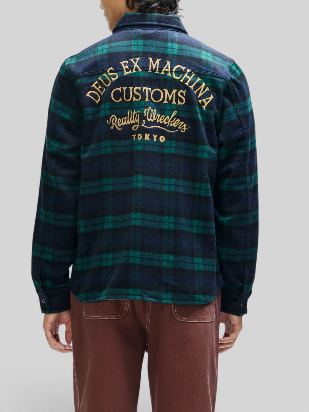 Baffle Haus Maxwell green check wool-blend shirt with gold embroidered back art, worn by a model from behind.