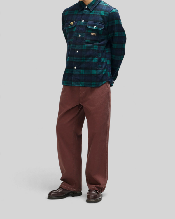 Baffle Haus Maxwell green check wool-blend shirt with chest pockets and snap buttons worn by a model