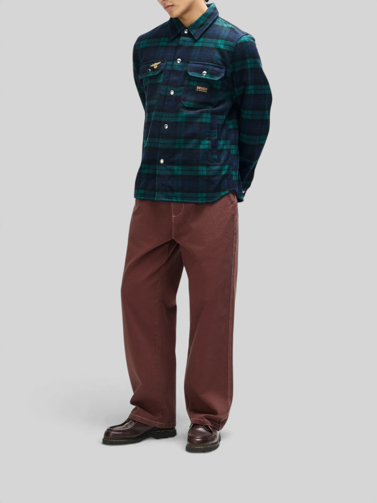 Baffle Haus Maxwell green check wool-blend shirt with chest pockets and snap buttons worn by a model