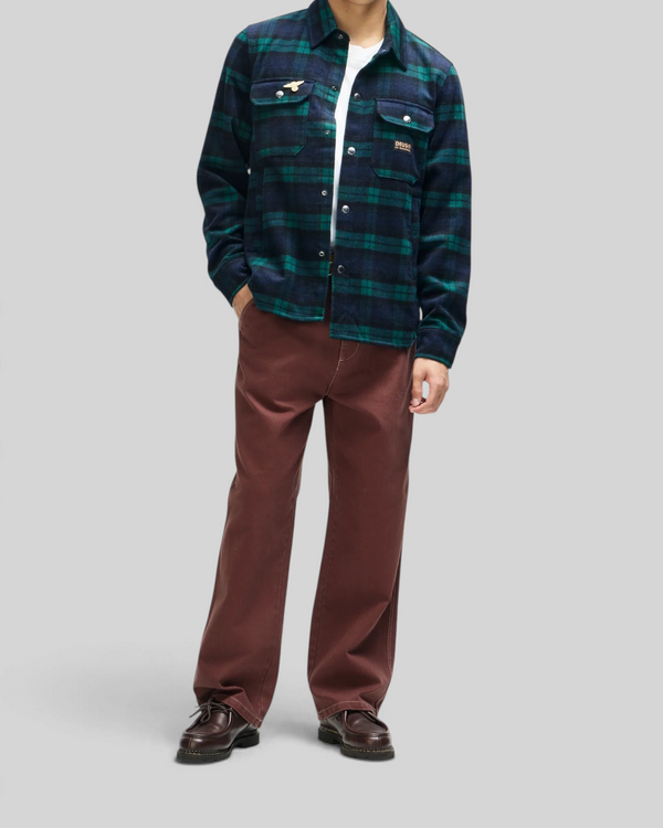 Baffle Haus Maxwell green check wool-blend shirt with chest pockets and snap closure worn by a model
