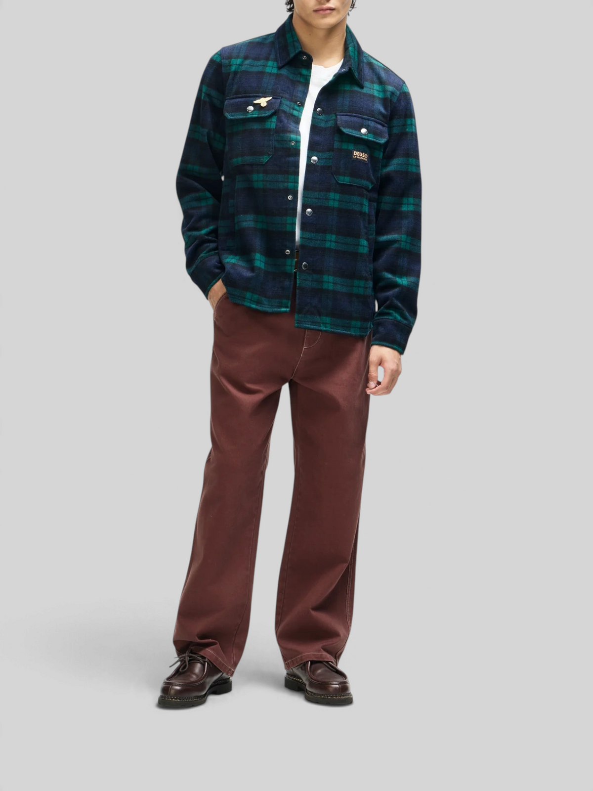Baffle Haus Maxwell green check wool-blend shirt with chest pockets and snap closure worn by a model