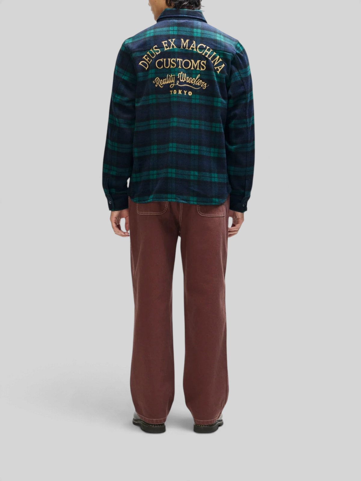 Baffle Haus Maxwell green check wool-blend shirt with back embroidery worn with brown trousers, rear view