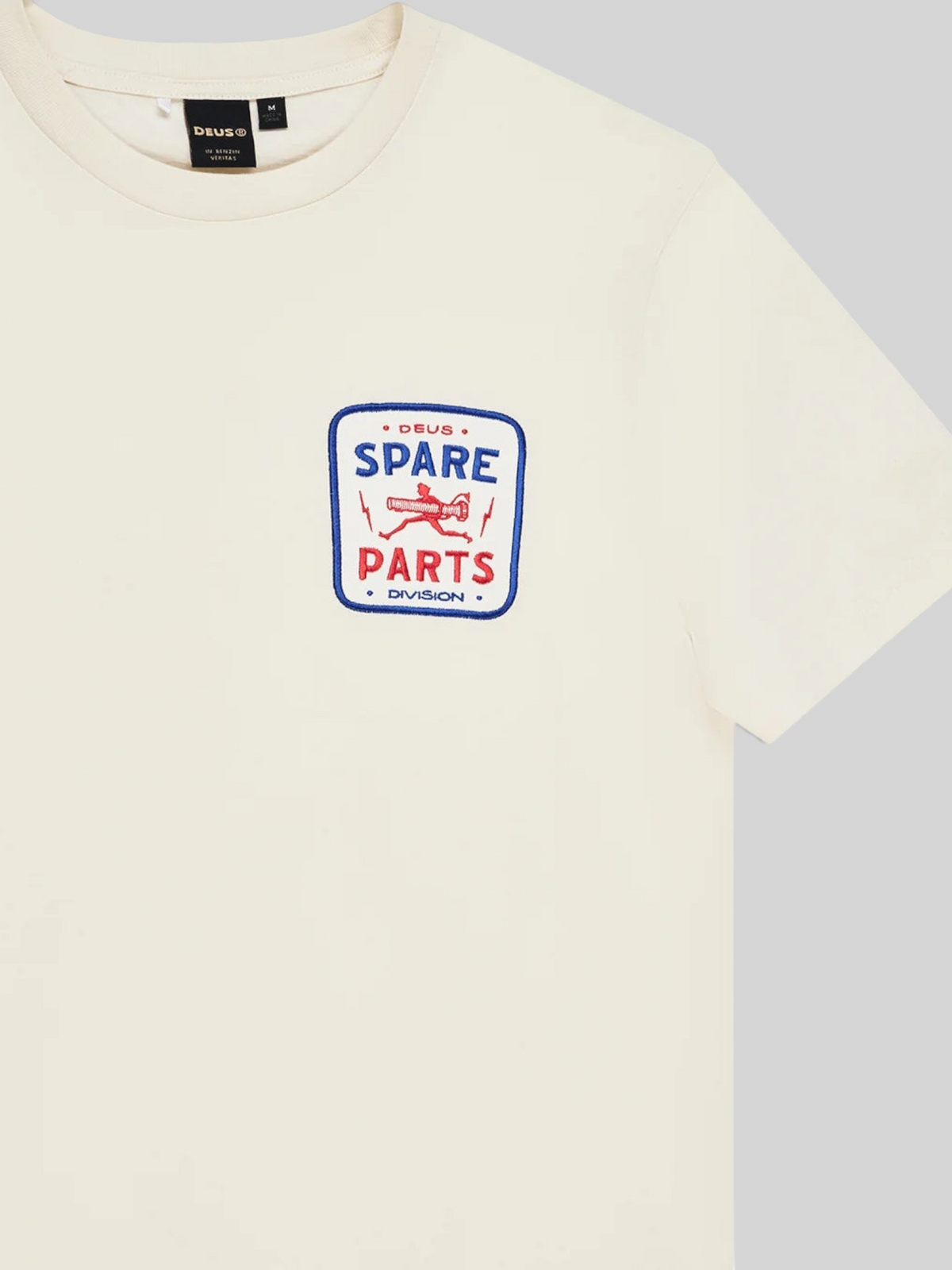 Baffle Haus Mudflap Tee in vintage white organic cotton with a blue and red graphic print on the chest