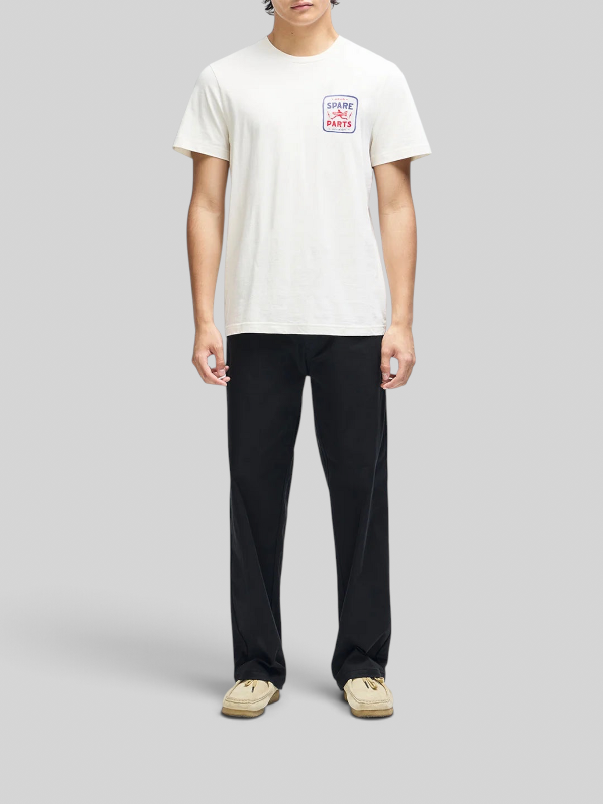 Baffle Haus Mudflap Tee in vintage white organic cotton with a boxy fit and Spare Parts chest graphic