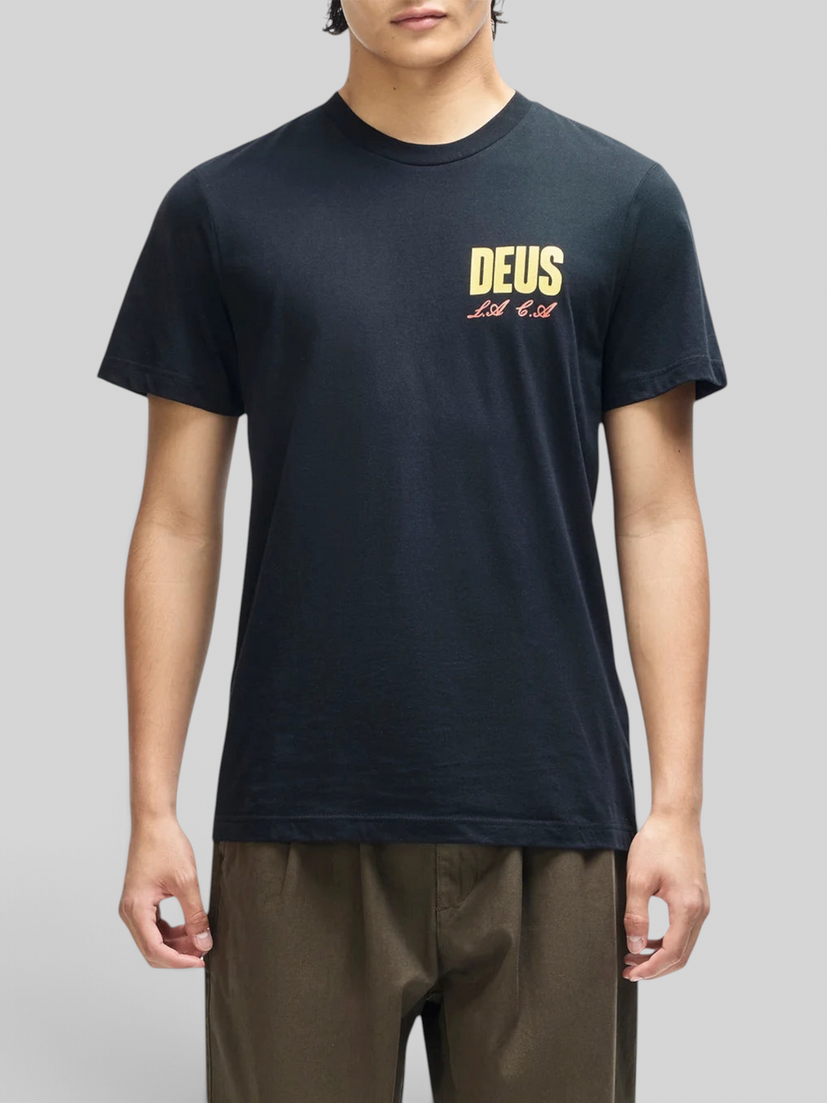 Baffle Haus black box fit organic cotton t-shirt with yellow and red chest graphic on a male model