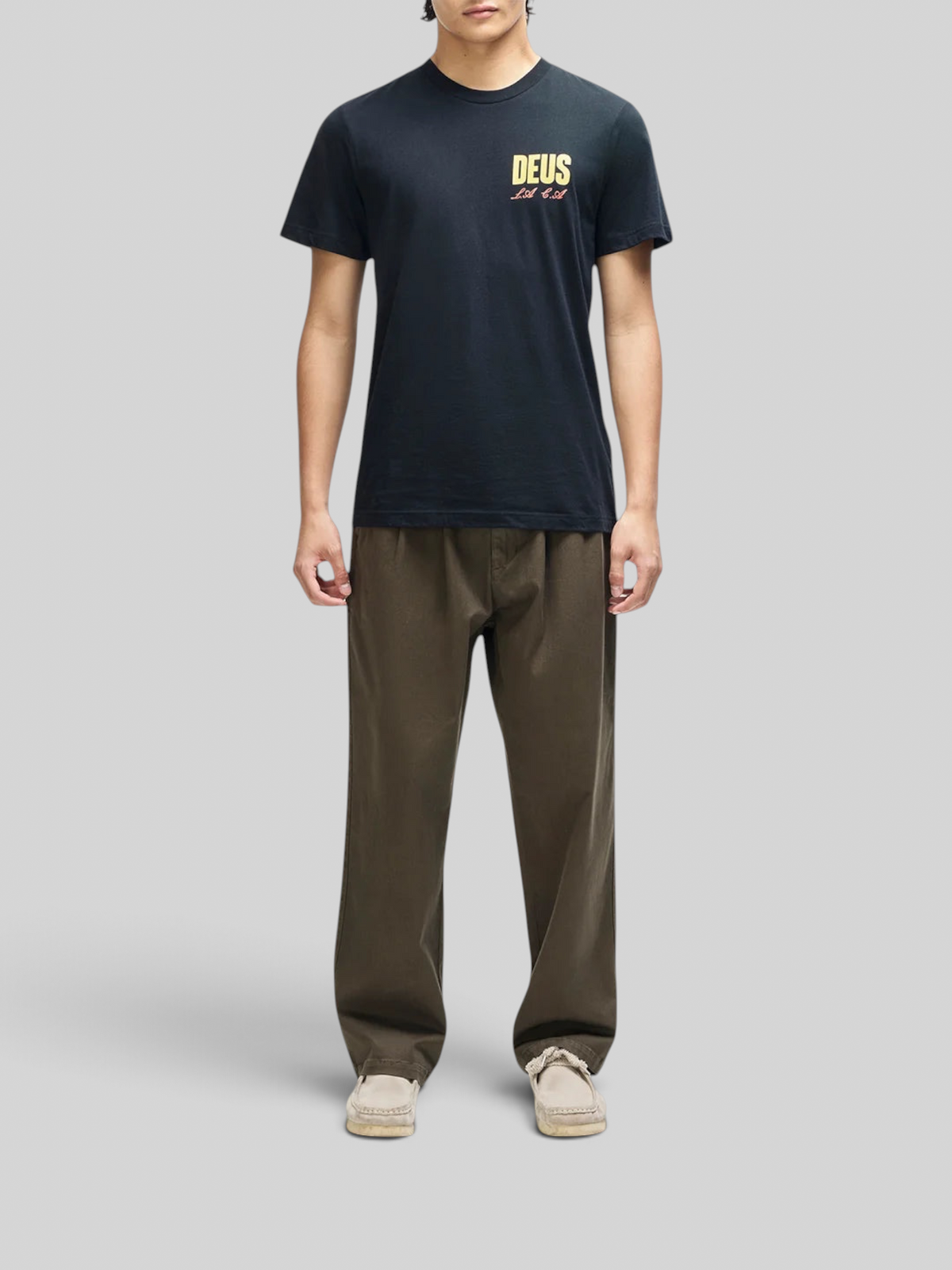 Baffle Haus black box fit organic cotton t-shirt with yellow chest graphic worn by a male model